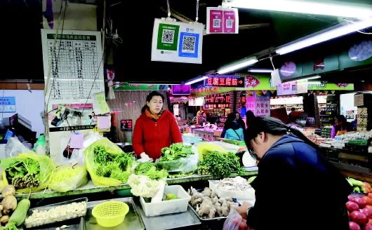 Vegetable market stall with QR codes