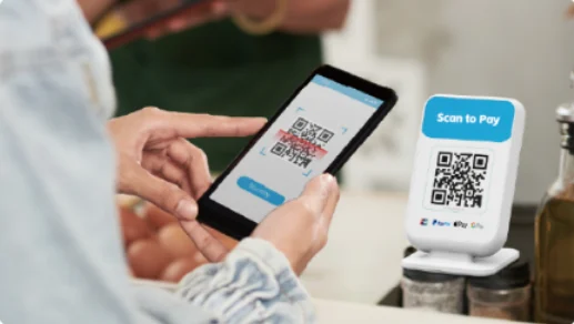 Customer scanning a sound box QR code with a phone