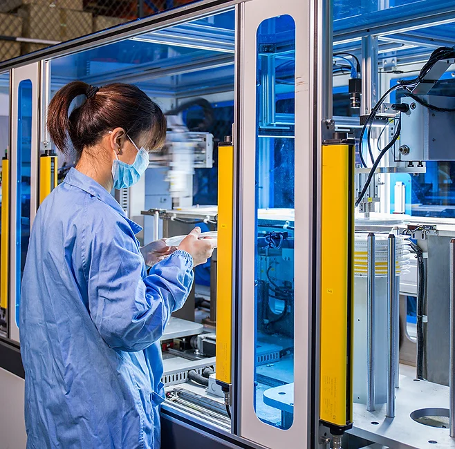 Engineer working on an automated assembly line